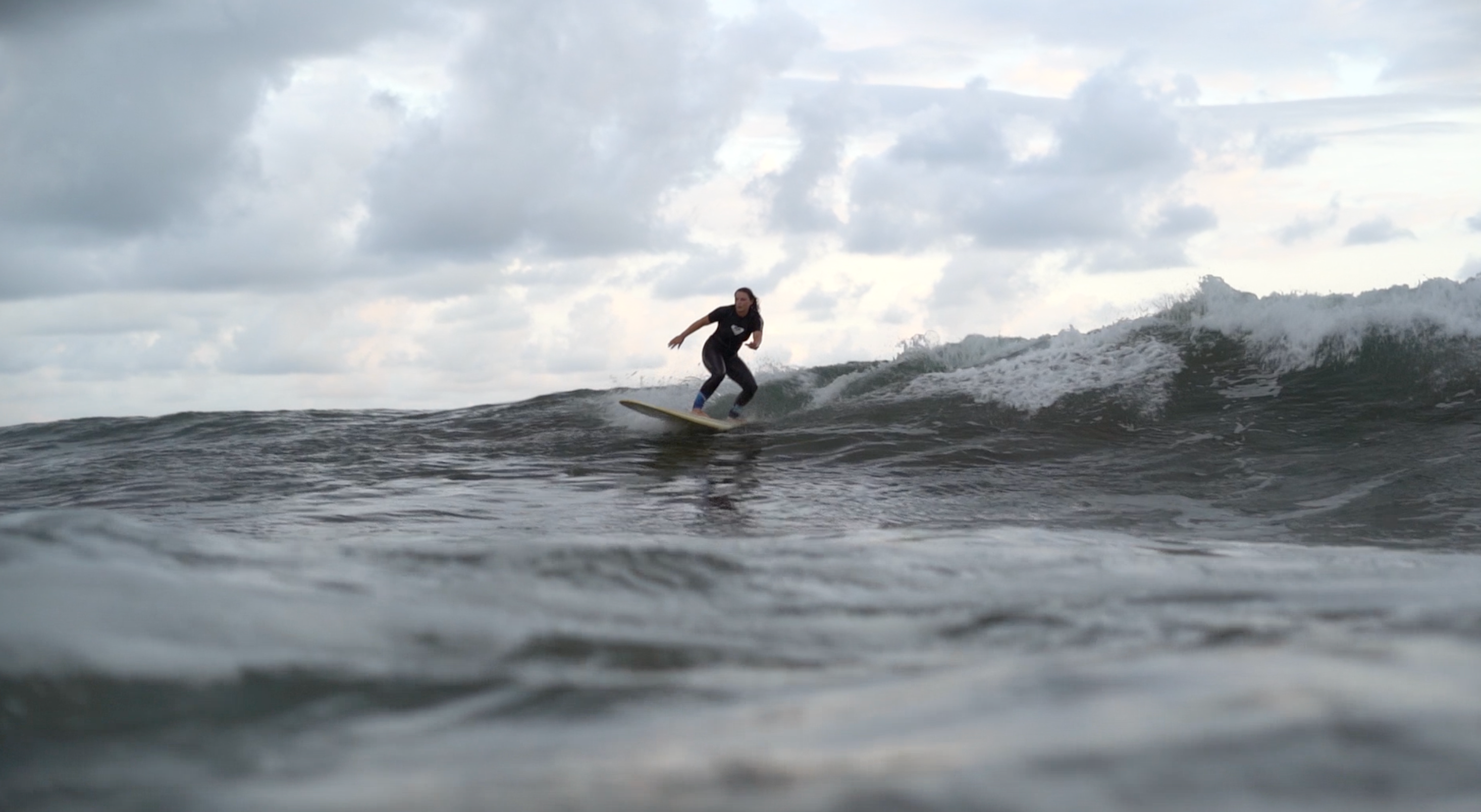 Image of woman surfing